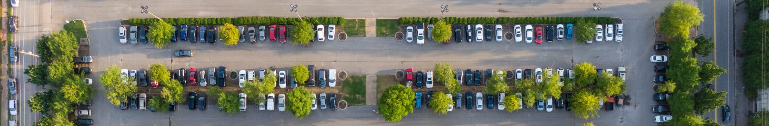 Aerial view of organized parking lot with smart parking technology